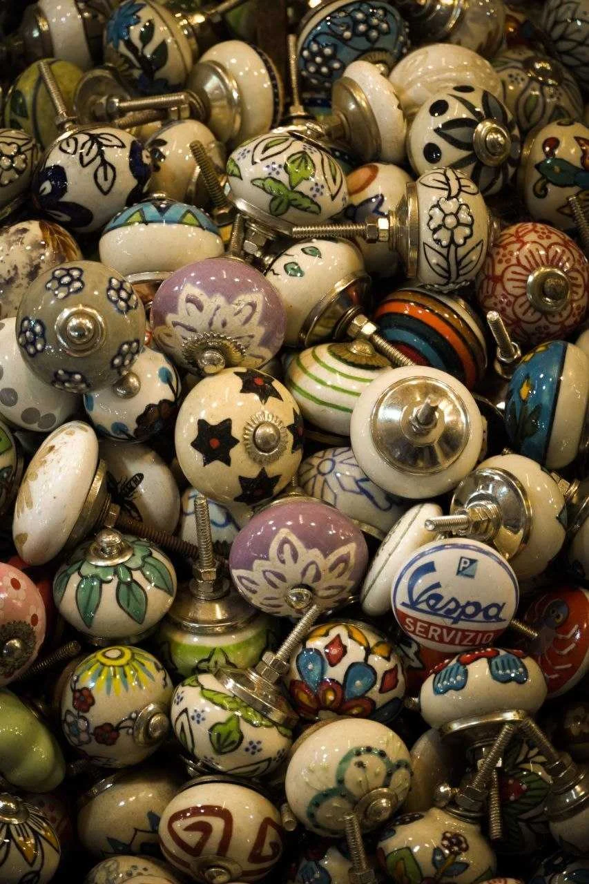 A close-up of patterned ceramic knobs