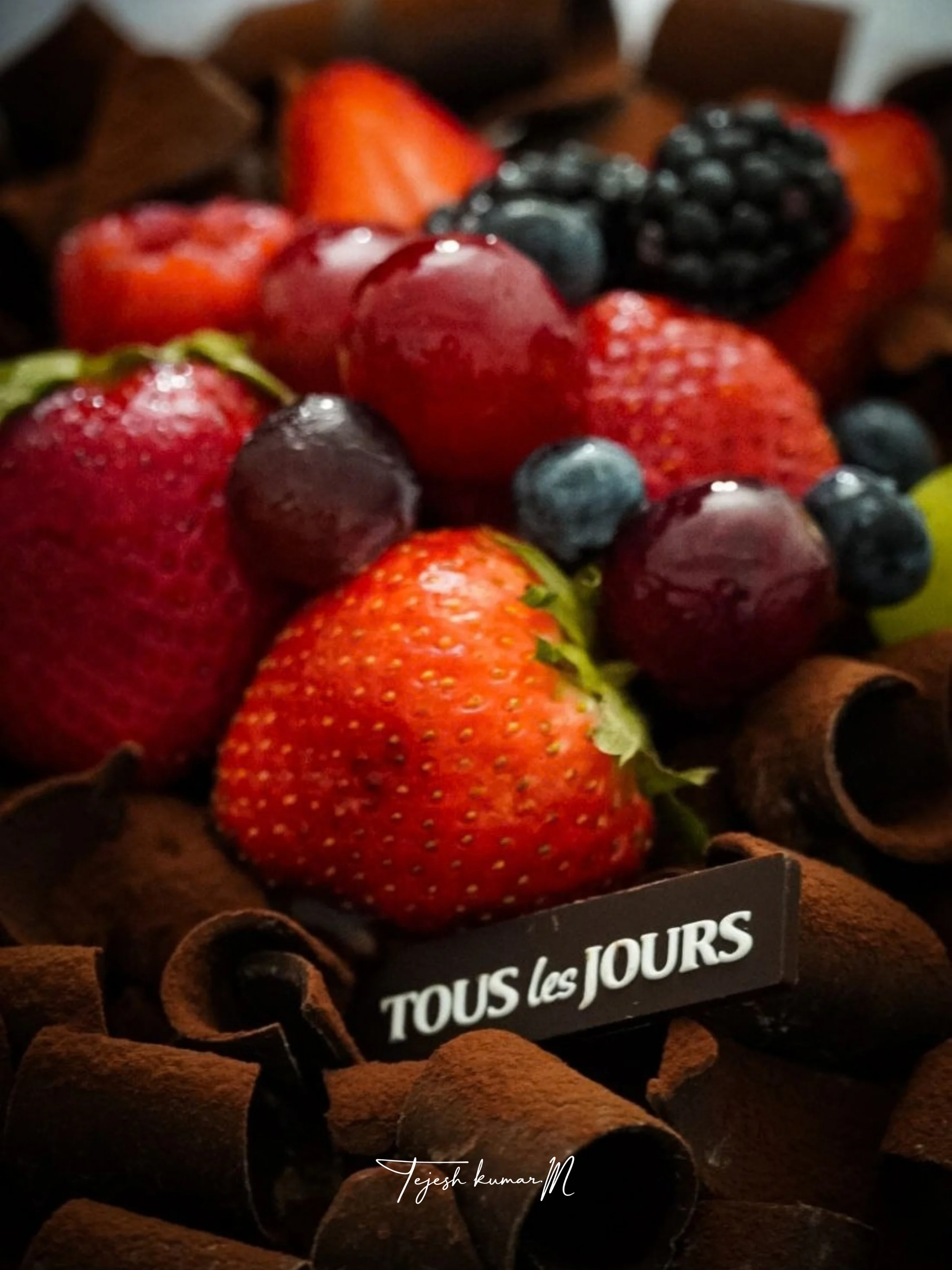 Strawberries and berries nestled in a chocolate dessert